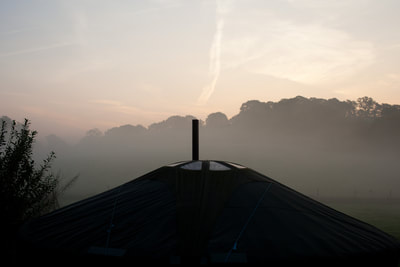 yurt chimney smoking dawn